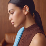 Aqua Insight gold-plated 925 sterling silver ear cuff, close-up on a model with a ponytail