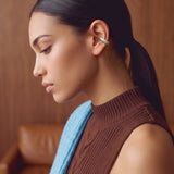 Aqua Insight gold-plated 925 sterling silver ear cuff, close-up on a model with a ponytail