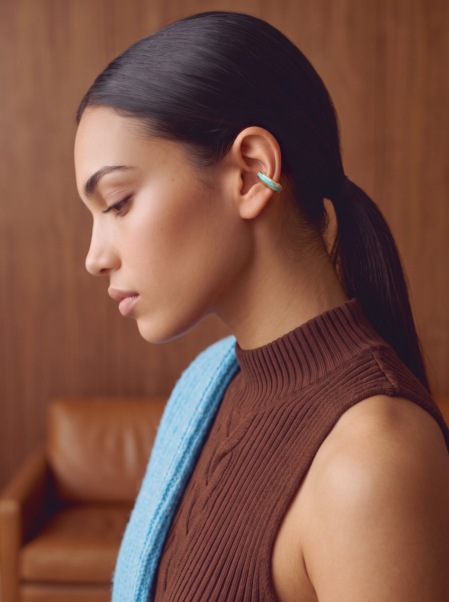 Aqua Insight gold-plated 925 sterling silver ear cuff, close-up on a model with a ponytail
