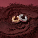 Blush Serenity gold- and silver-plated ear cuffs with powder pink enamel on coffee grounds