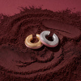 Blush Serenity gold- and silver-plated ear cuffs with powder pink enamel on coffee grounds