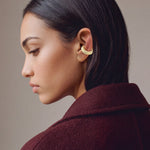 Hola Aura gold-plated 925 sterling silver ear cuff, close-up on the ear