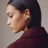 Hola Aura gold-plated 925 sterling silver ear cuff, close-up on the ear