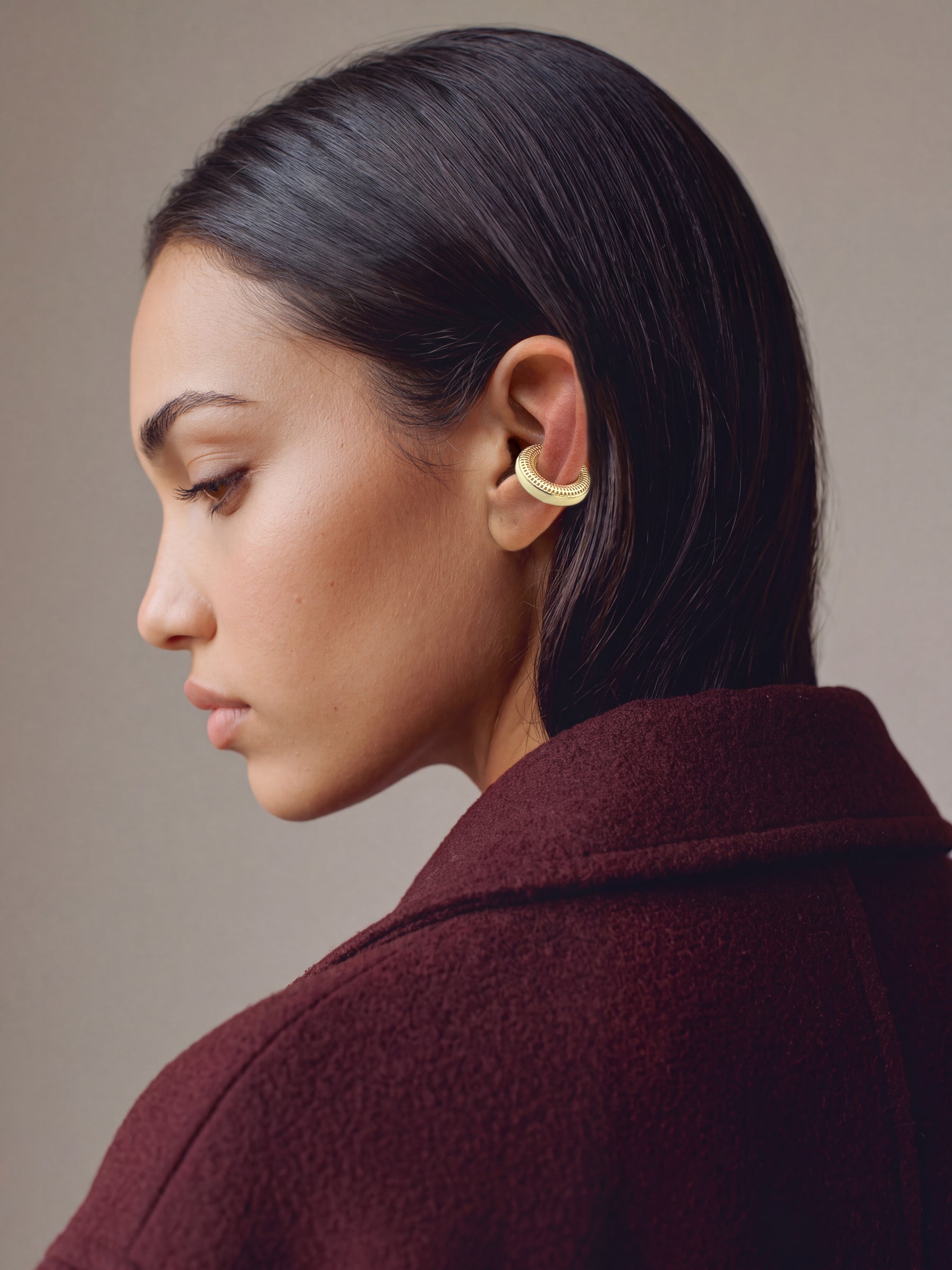 Hola Aura gold-plated 925 sterling silver ear cuff, close-up on the ear