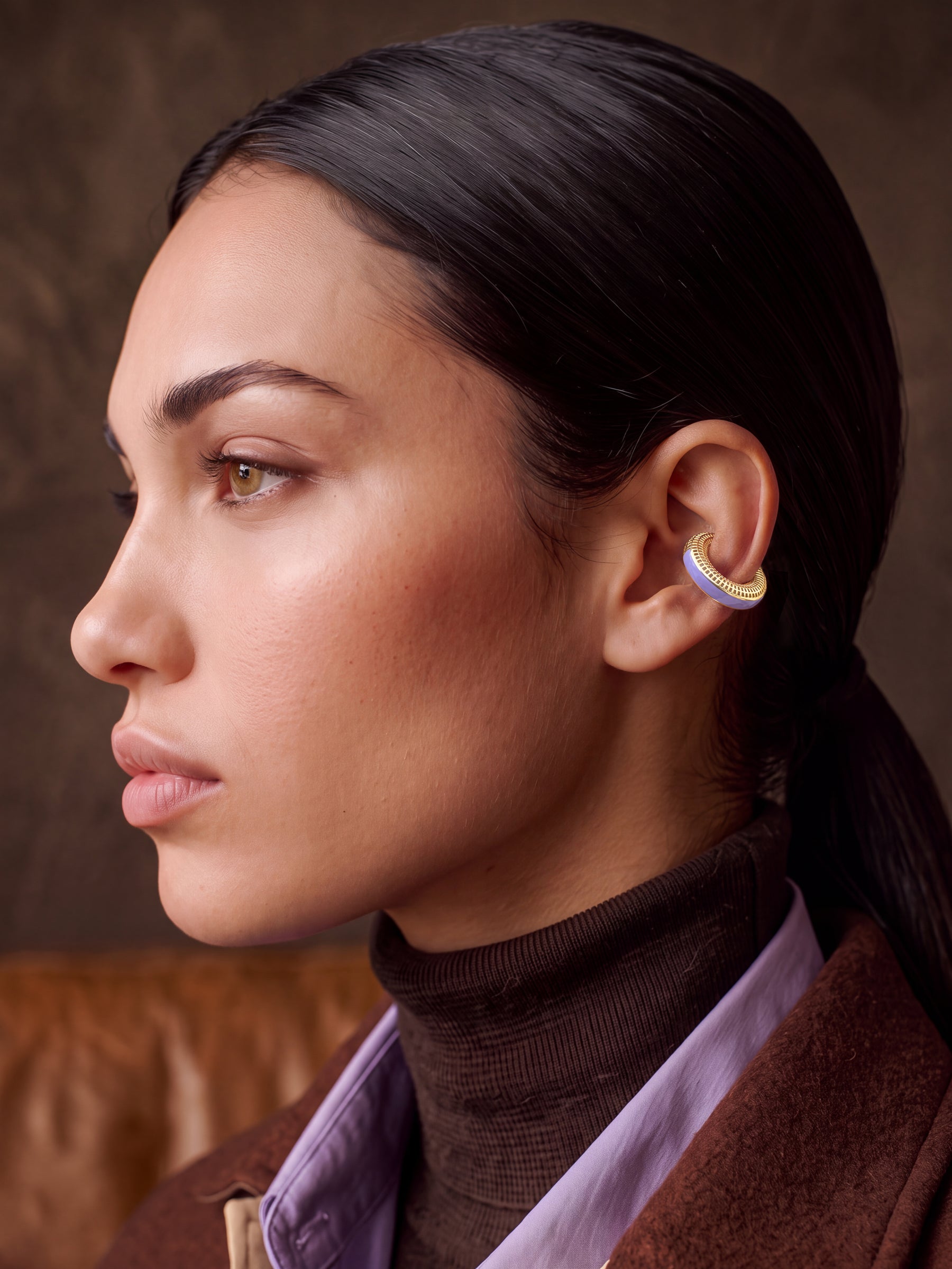 Lilac Reverie 14K gold-plated ear cuff on a model in a brown turtleneck, profile view