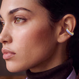 Lilac Reverie gold-plated ear cuff with lilac enamel, close-up on the ear