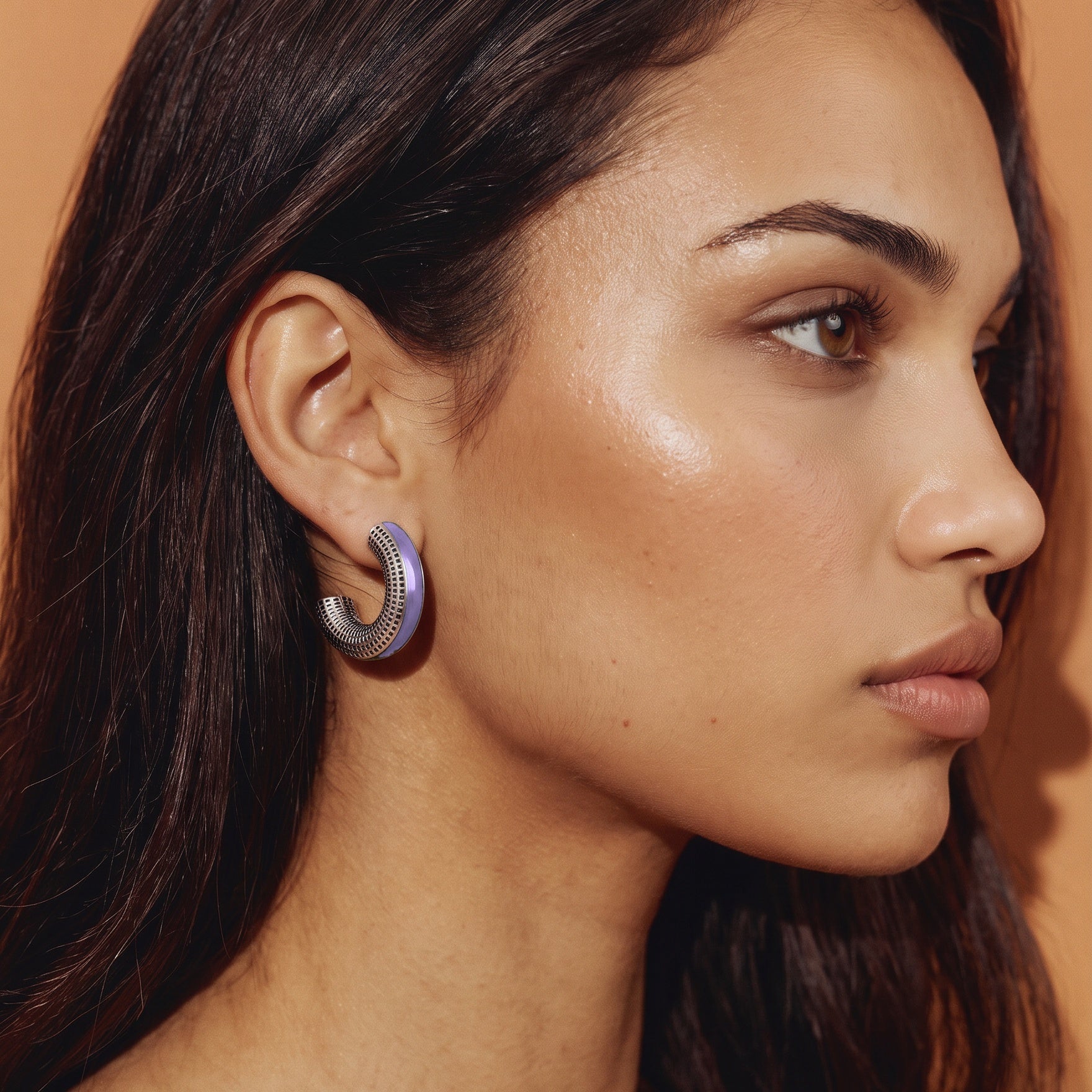 Model in profile against a warm camel backdrop wearing Lilac Reverie lilac enamel silver earrings