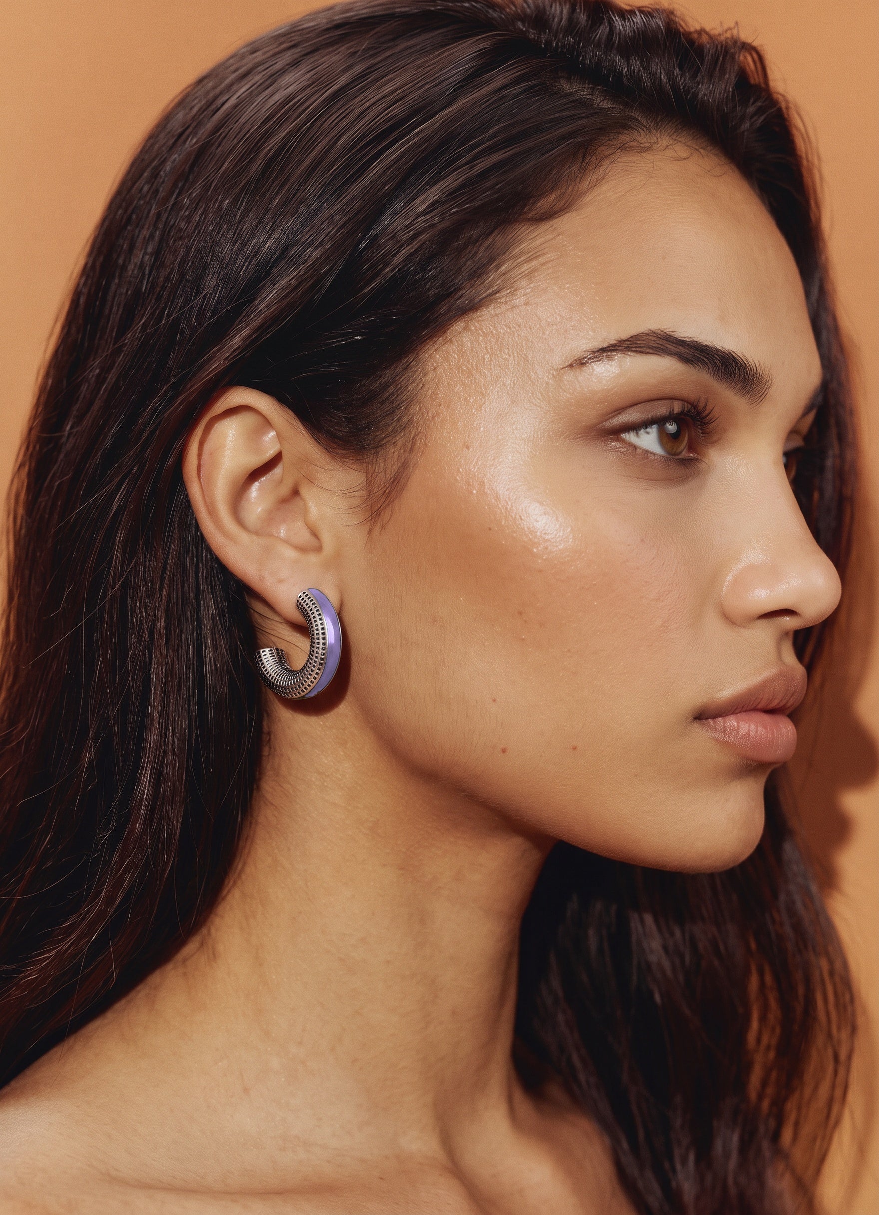 Model in profile against a warm camel backdrop wearing Lilac Reverie lilac enamel silver earrings