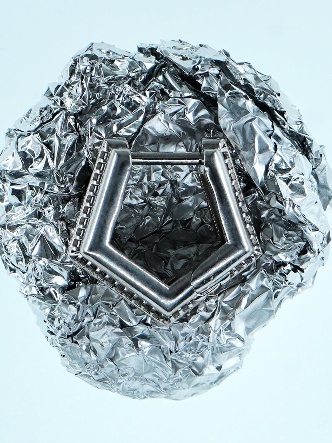 Mini Verta Earrings on a crystal sphere, geometric form detail