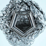 Mini Verta Earrings on a crystal sphere, geometric form detail