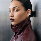 Model wearing the Octa Ear Cuff in profile, burgundy leather jacket, no-piercing 925 sterling silver ear cuff