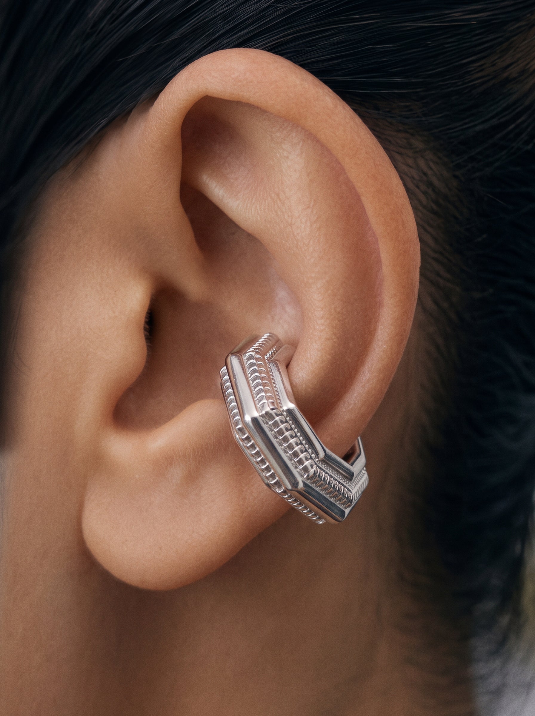 Close-up of the Octa Ear Cuff on the ear, layered octagonal form, rhodium-plated 925 sterling silver no-piercing cuff