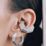 Close-up of the Octa earring with an UNBOUND ear cuff, rhodium-plated 925 sterling silver layered octagonal form