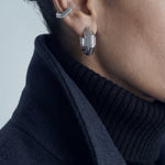 Octavia earrings – layered octagonal hoop in rhodium-plated 925 sterling silver worn with an ear cuff and a navy coat