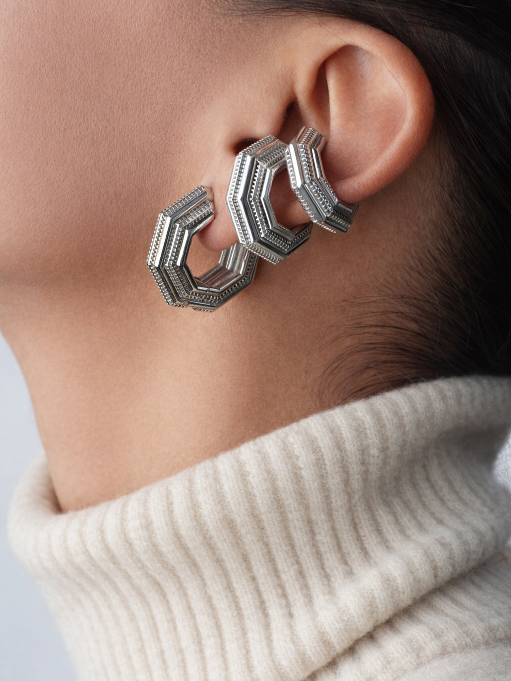 Layered ear look with three Octavia Ear Cuffs, cream turtleneck