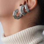 Layered ear look with three Octavia Ear Cuffs, cream turtleneck