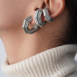 Layered ear look with three Octavia Ear Cuffs, cream turtleneck